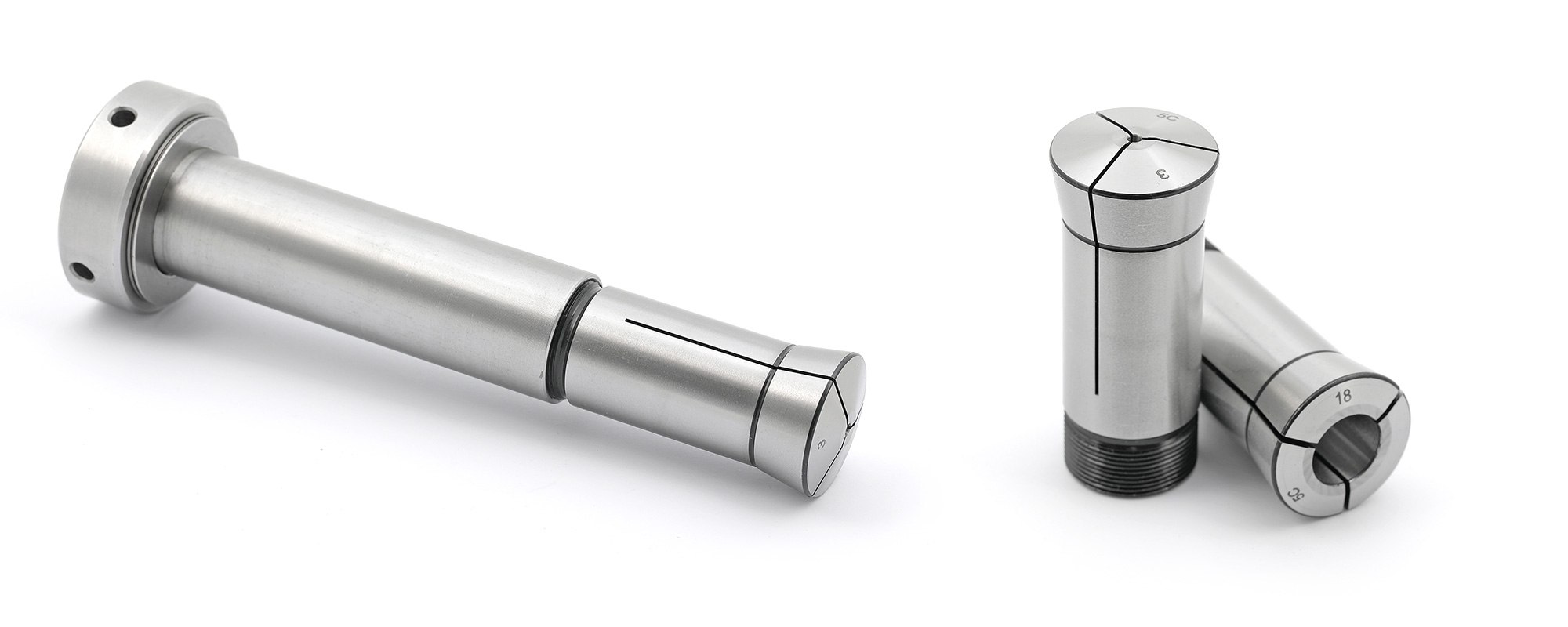 5C collets: an extended-nose collet on its drawbar and two standard slit collets